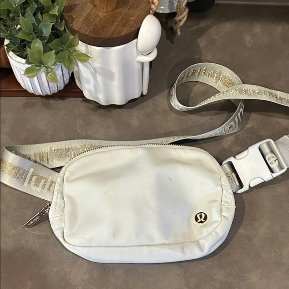 lululemon athletica Handbags - Lululemon light Gray Belt Bag with Gold Logo